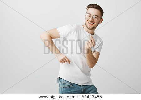 Check Out My Moves. Portrait Of Carefree Delighted And Happy Young Male Student With Beard In Glasse