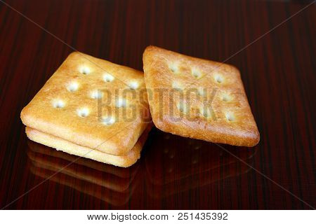 Sweet And Salty Biscuits On Dark Background