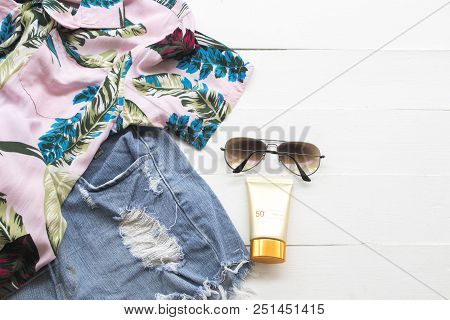 Natural Cosmetics For Skin Face Sunscreen Spf50 ,sunglasses ,short Jeans Trousers And Shirt Of Woman
