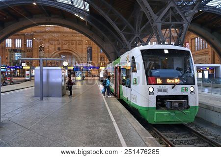 Leipzig, Germany - May 9, 2018: People Board Erfurter Bahn Train At The Railway Station (hauptbahnho