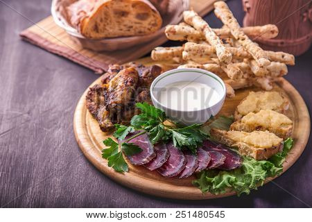 Beer Snack With Copyspace.  Fried Chicken Wings, Basturma,  Sandwiches With Capelin Caviar And   Bre