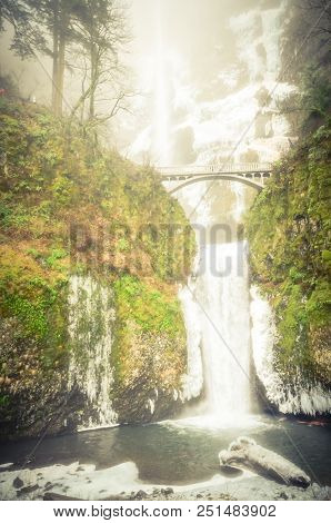 Vintage Tone Icy Lower Tier Multnomah Falls Oregon In Wintertime