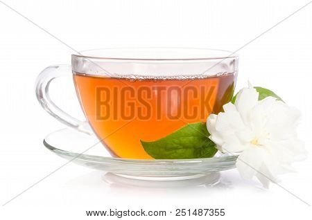 Glass Cup Of Tea With Jasmine Flowers And Leaves Isolated On White Background