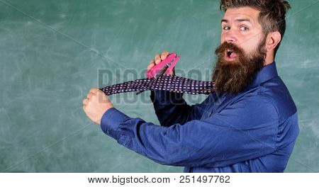 Man Scruffy Use Stapler Dangerous Way. Hipster Teacher Formal Wear Necktie Holds Stapler. School Sta