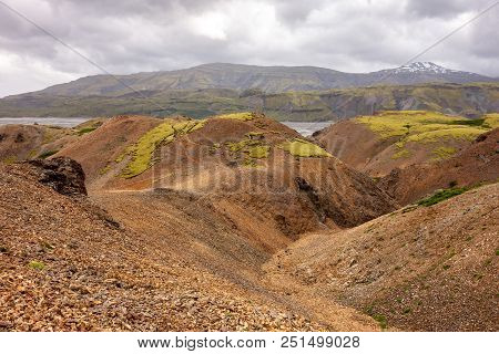 Landscape Of Red Mountains And Moss In Lonsoraefi, Iceland With Overcast Weather