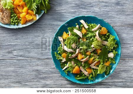 Fresfly picked natural vegetables and fruits for cooking healthy food. Top view of the ingredients for cooking of salad from fresh natural products.