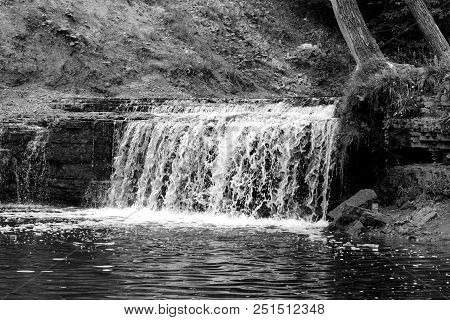 Small Waterfall On Sablinka River In Leningrad Region, Russia. Black And White.