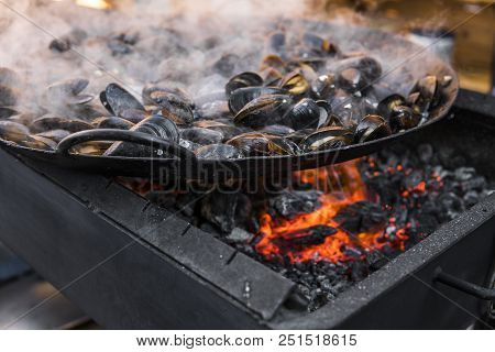 Fresh Mussels At Grill Pan. Seafood Barbecue Outdoors. Picnic Healthy Food, Mussels In Shells. Plent