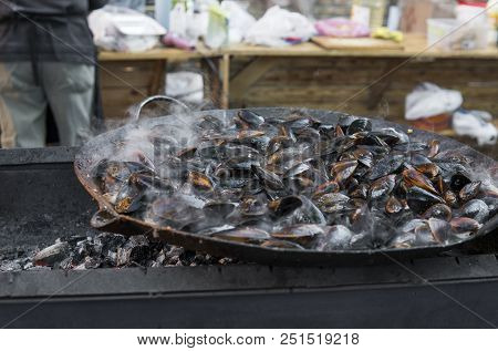 Fresh Mussels At Grill Pan. Seafood Barbecue Outdoors. Picnic Healthy Food, Mussels In Shells. Plent