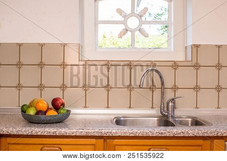 Old Farmhouse Kitchen Sink And Faucet Vintage Design With Pattern Tiles And Cozy Window And Colorful