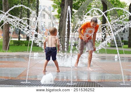 Gomel, Belarus Children Bathing In The Fountain. Square Named After Gromyko