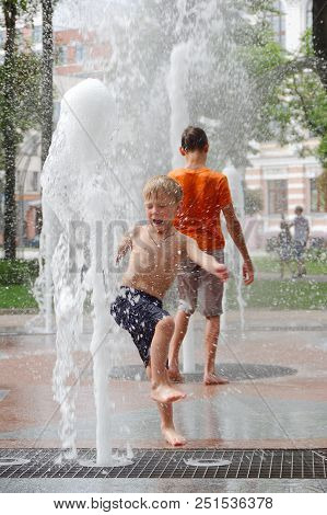 Gomel, Belarus Children Bathing In The Fountain. Square Named After Gromyko