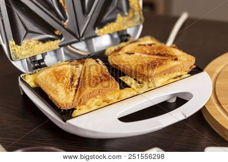 Detail Of Hot Sandwiches Ready For Eating In A Sandwich Maker. Selective Focus On The Sandwiches