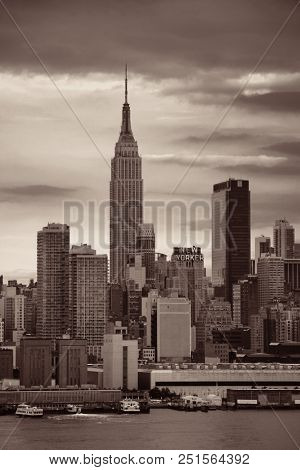 NEW YORK CITY - JUL 4: Empire State Building with skyscrapers on July 4, 2015 in Manhattan, New York City. With population of 8.4M, it is the most populous city in the United States.