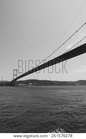 Perspective of Fatih Sultan Mehmet Bridge over Bosporus Strait in Istanbul, Turkey. Black and white
