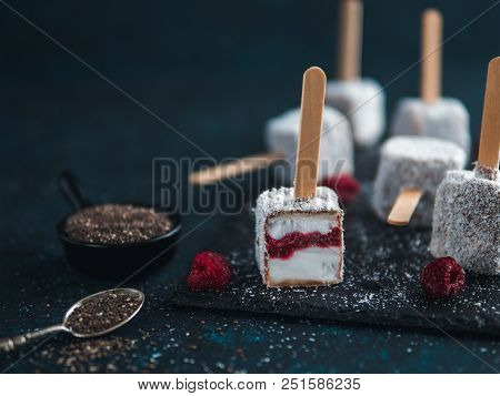 Homemade Raw Lamington Ice Cream Pops On Dark Background. Australian Sweet Dessert Lamington With Ch