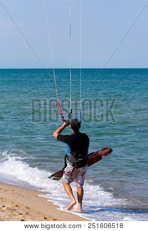 Shkorpilovtsi, Bulgaria - June 29, 2018: Man Kiteboarding At The Sea Beach. Kiteboarding, Kitesurfin
