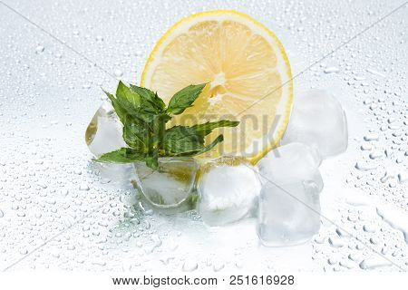 Lemon Ring With Ice And Mint On A Silvery Background Closeup