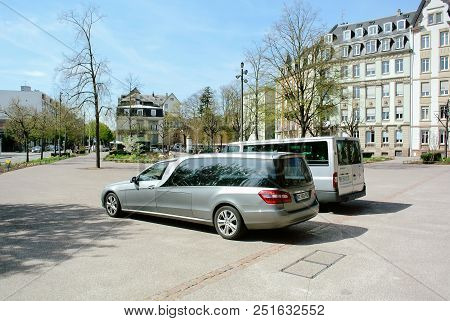 Paris, France - Apr 17, 2013: Mercedes-benz Hearse Vehicle Parked In Front Of The Church Next To A P