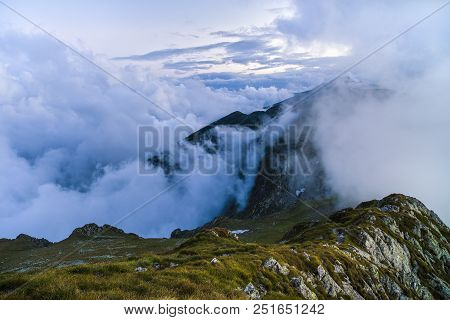 Summer Landscape With High Mountains And Clouds In A Summer Day