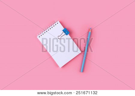 Top View Of Blank Notebook With Peb On Colorful Background Pink With Copy Space.