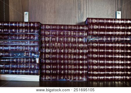 A Stack Of Many Torahs In A Synagogue