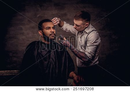 Bearded African American Hipster Guy Getting A Haircut By An Old-fashioned Tattoed Professional Hair