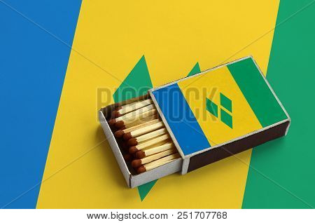 Saint Vincent And The Grenadines Flag  Is Shown In An Open Matchbox, Which Is Filled With Matches An
