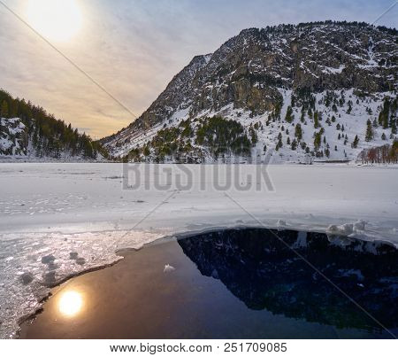 Panticosa snow frozen lake ice in Huesca Pyrenees of Spain