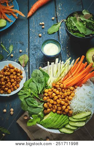 Top View Of Ingredient Set For Cooking Vegan Food, Fried Chickpeas, Rice Noodles With Wegetables On 