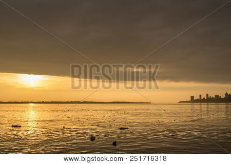 Water Pollution In A River During The Sunset