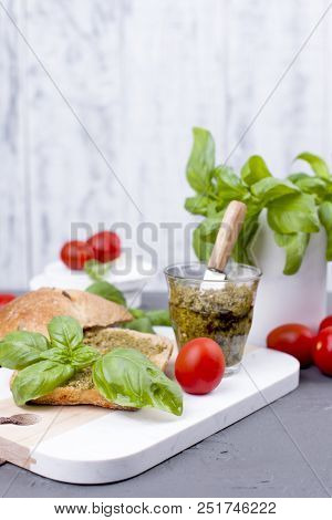 Salad Caprese In Fresh Bread And Pesto Sauce For Lunch. A Breakfast Sandwich With Basil And Mazarell