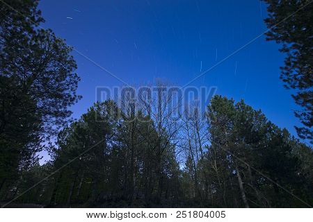 A View Of The Stars Of The Milky Way With A Mountain Top In The Foreground. Night Sky Nature Summer 