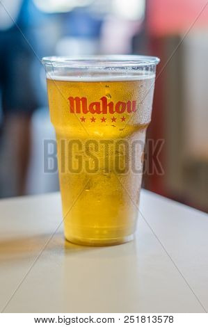 Barcelona, Spain - June 9, 2018: Cold Mahou Beer In A Plastic Cup In Mcdonald Restaurant. Beer Serve