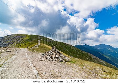 Stone Piles On Mountain Trail