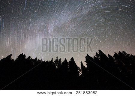 A View Of The Stars Of The Milky Way With A Mountain Top In The Foreground. Night Sky Nature Summer 