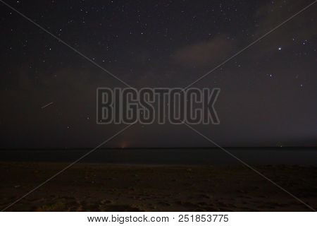 A View Of The Stars Of The Milky Way With A Mountain Top In The Foreground. Night Sky Nature Summer 