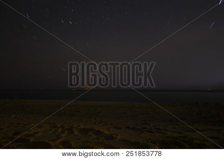 A View Of The Stars Of The Milky Way With A Mountain Top In The Foreground. Night Sky Nature Summer 