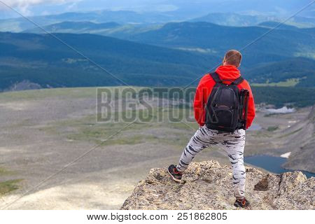 Man Hiker Enjoy The View At Sunset Mountain Peak Cliff.photographer Traveler On  High Mountaint  Sty