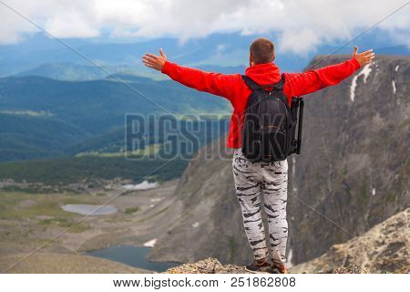 Man Hiker Enjoy The View At Sunset Mountain Peak Cliff.photographer Traveler On  High Mountaint  Sty