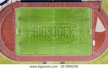 A Real New Soccer Field, Football Field. Green Grass. Green Striped Lawn. White Markings On The Gras