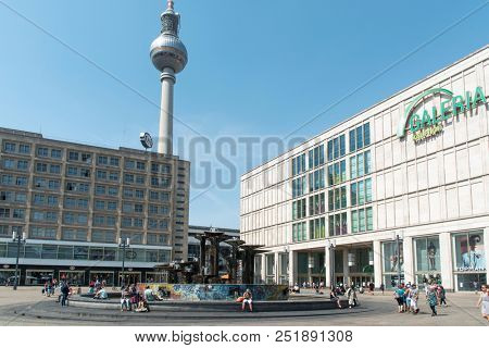 BERLIN, GERMANY - MAY 28, 2018: A view of the Alexanderplatz square, with the Brunnen der Volkerfreundschaft fountain in the center and the popular Television Tower in the background