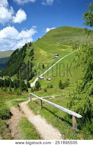 Green Landscape With Mountain Huts Viewed From A Hiking Path Leading To Mount Pic (above Raiser Pass
