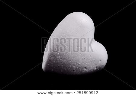 White Polystyrene Heart On A Black Background