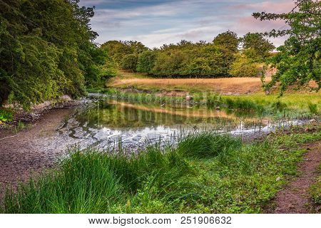 Low Water At Littlemill Quarry Pond.  The Nature Reserve Is A Disused Limestone Quarry In Northumber