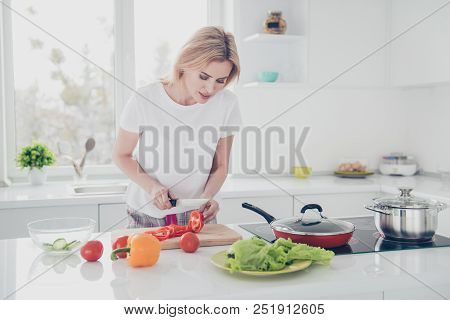 Charming Adorable Attractive Woman Wearing Pajama Chopping With Knife Red Pepper On Board In Kithcen