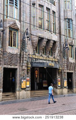 Amsterdam, Netherlands - July 10, 2017: People Walk By Movie Theater Pathe Tuschinski In Amsterdam. 