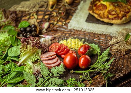 Pizza Ingredients On Table. Ingredients With Pizza Dough