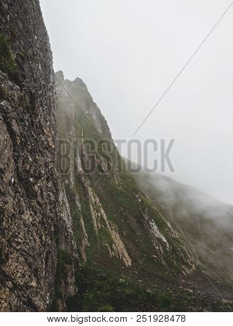 Scary Steep Mountain Scenery Covered In Fog In The Swiss Alps Brienzer Rothorn Switzerland