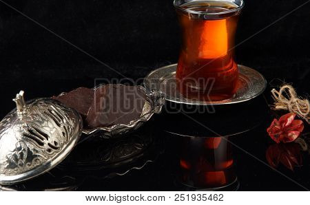 Halva In Chocolate On A Plate And Hot Tea, Delicious Turkish Dessert.